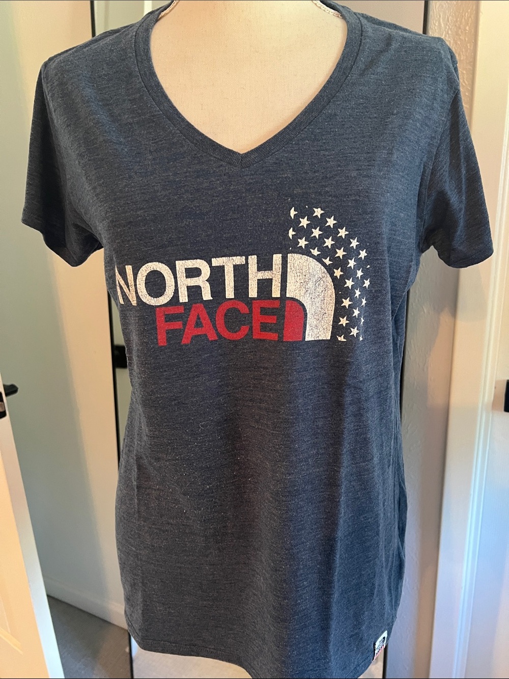 The North Face Women's Navy Blue V-Neck Logo Tee with Red and White Accents